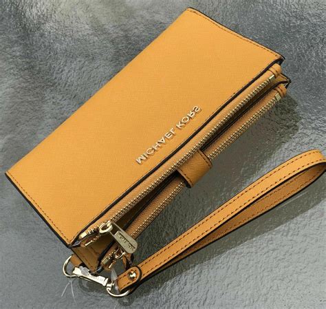 michael kors phone wallet apple|Michael Kors double zip wallet.